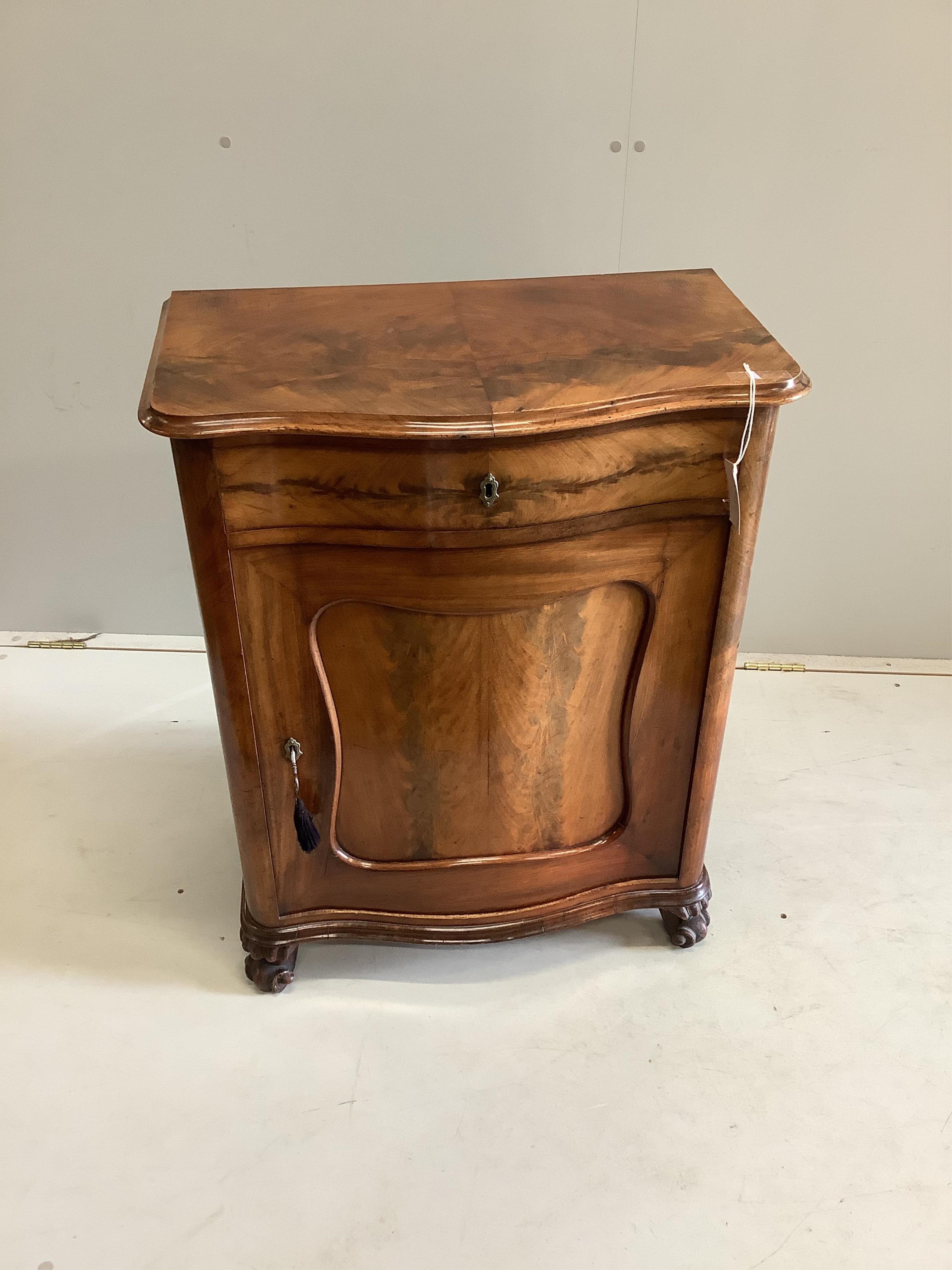 A 19th century French mahogany serpentine fronted side cabinet, with frieze drawer above a cupboard, on scrolled feet, width 66cm, depth 38cm, height 83cm. Condition - fair-good